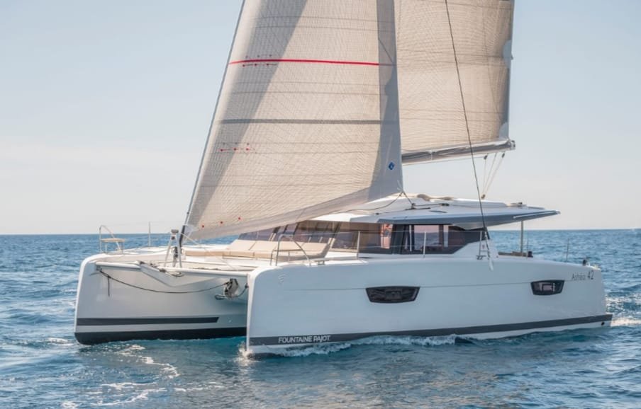 Luxury catamaran sailing along the Riviera Maya coastline